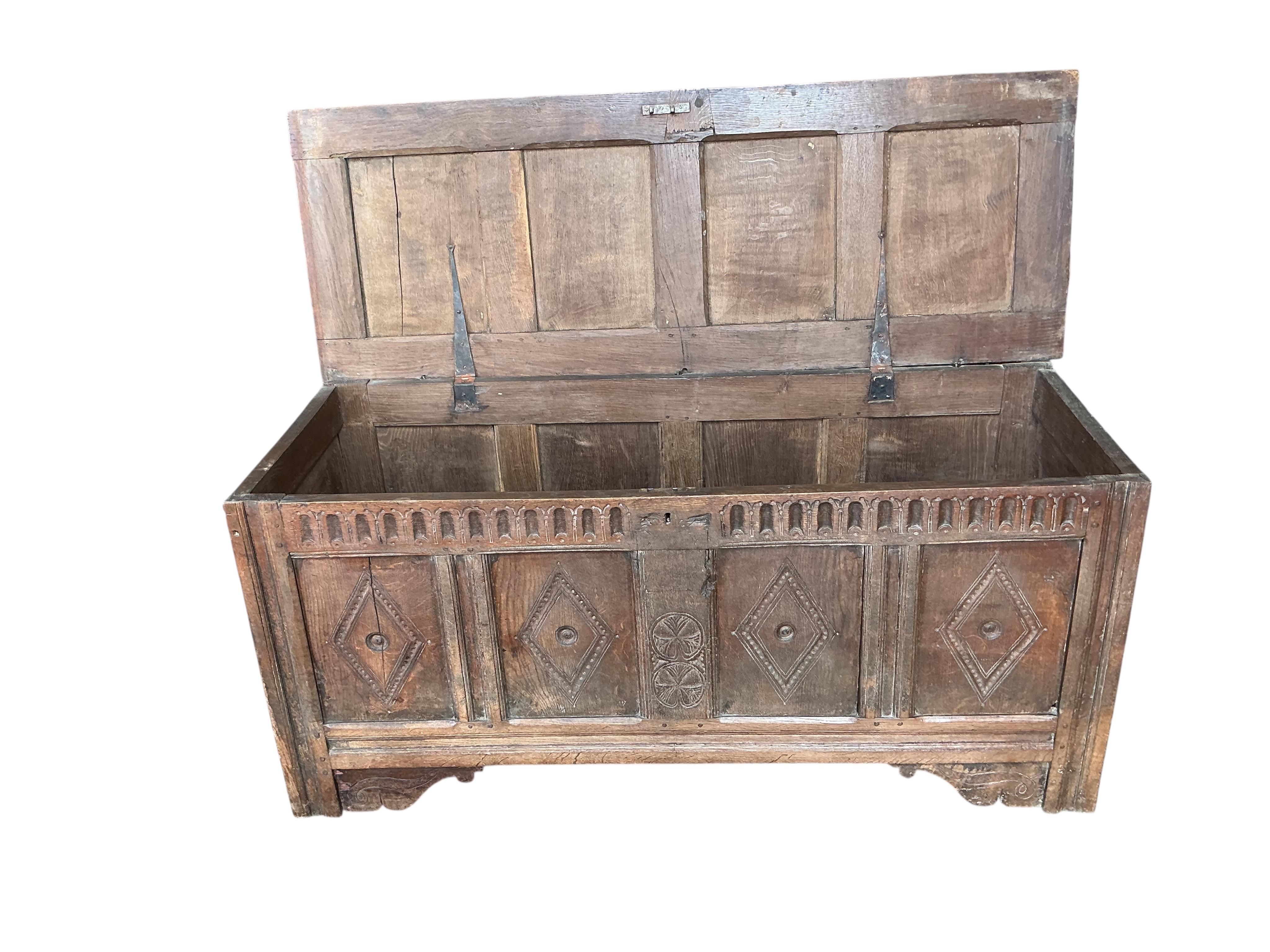 A carved oak coffer, width 146cm, depth 53cm, height 67cm